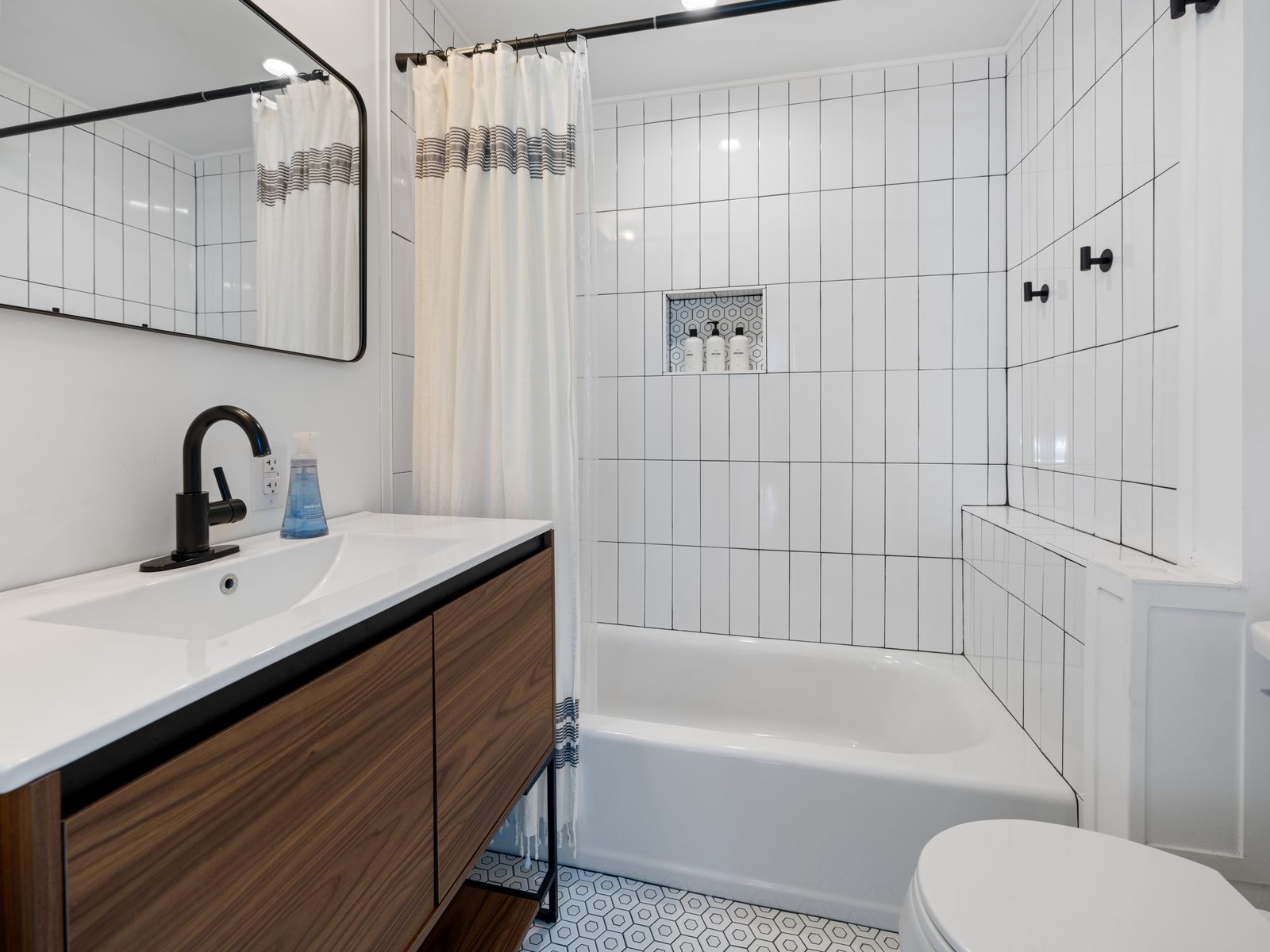 Full bathroom with modern tile work
