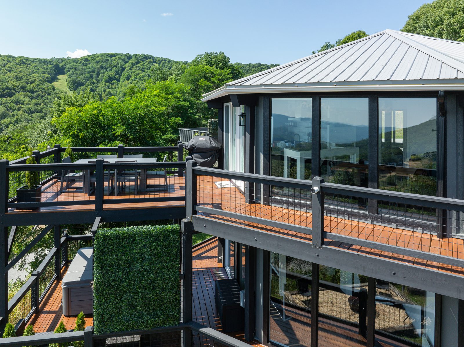 Upper deck dining area with mountain views