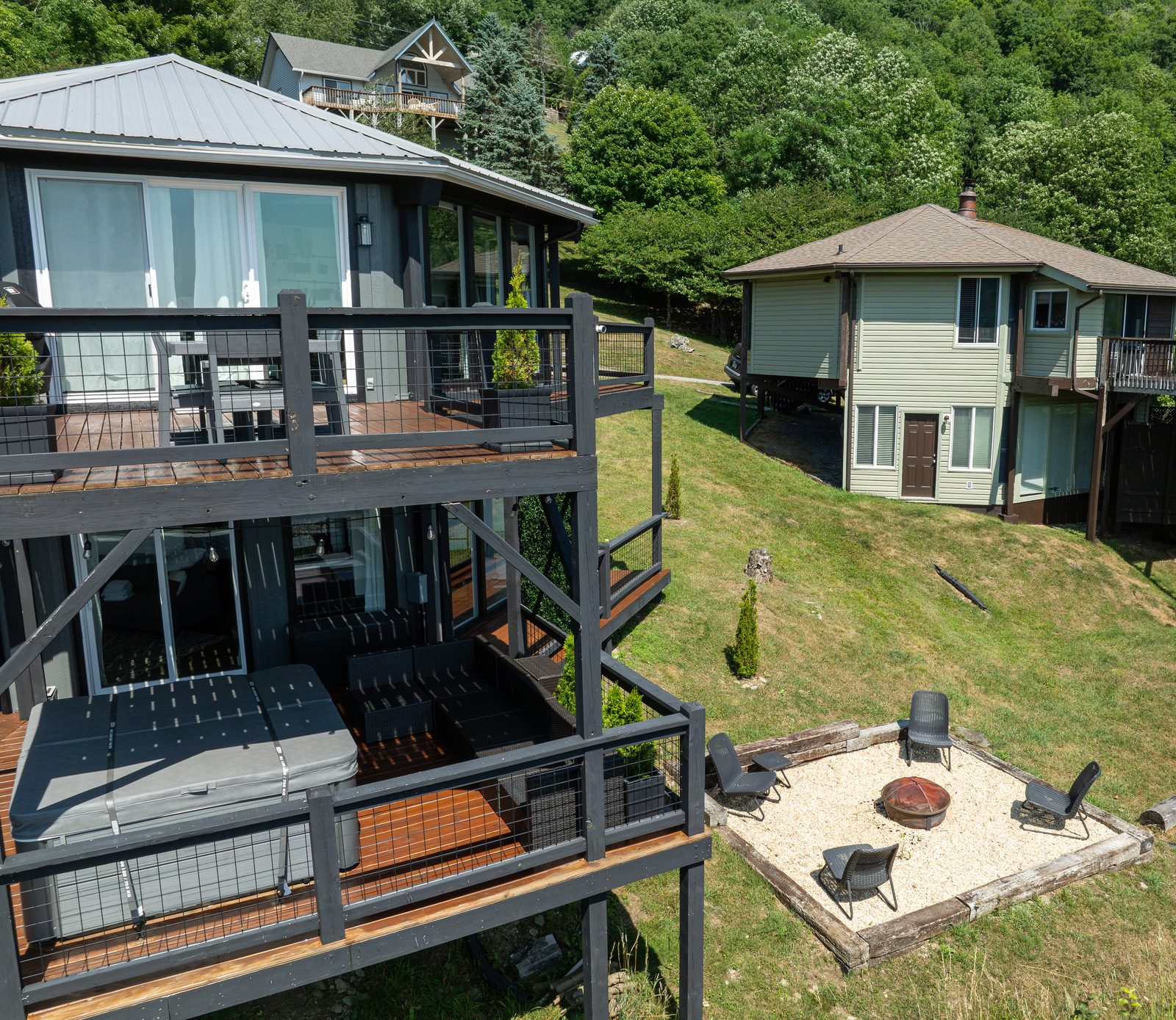 Side view with fire pit and mountain backdrop