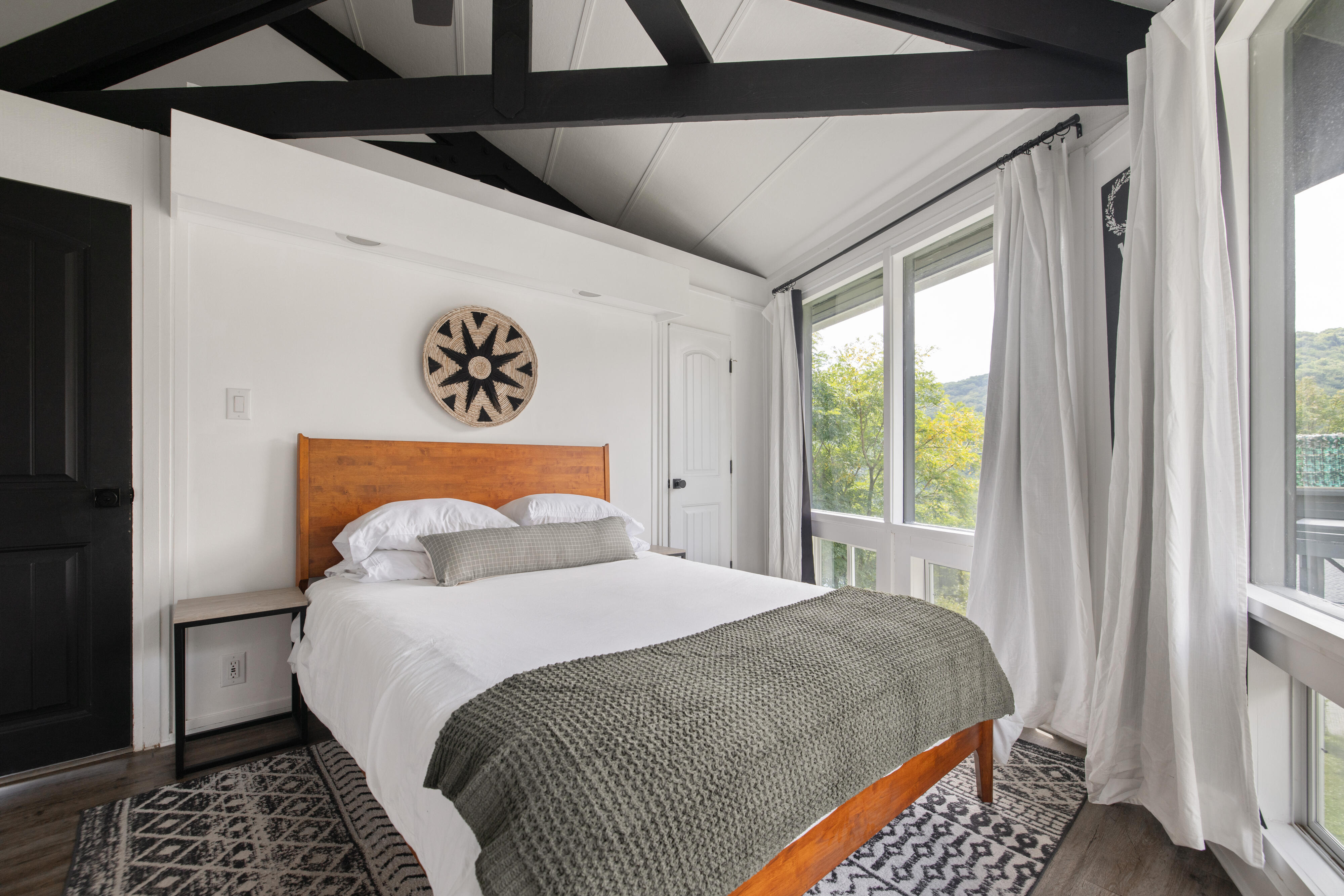 Queen bedroom with natural light and attached full bath